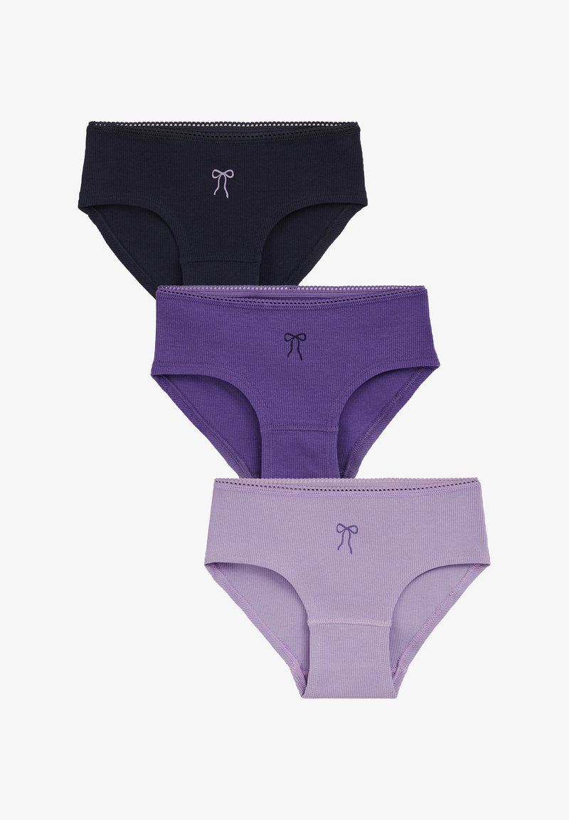 Trois slips en coton côtelé pour femmes en noir, violet foncé et violet clair, chacun avec un petit nœud au centre de la ceinture avant.