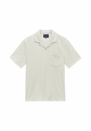 Korte mouwen polo shirt in lichtbeige. Zachte stof met een textuurafwerking, voorzien van een puntige kraag en een enkele borstzak.