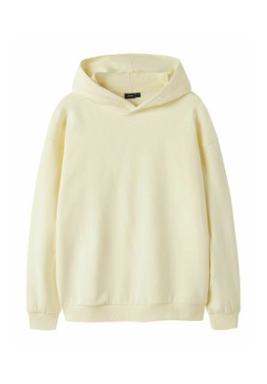 Hanorac simplu, de culoare crem, cu mâneci lungi, manșete drepte și glugă, prezentat pe un fundal alb.