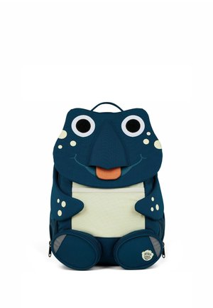 Children’s navy blue backpack designed as a smiling frog with large eyes, tongue, and spots, featuring front and side zip pockets.