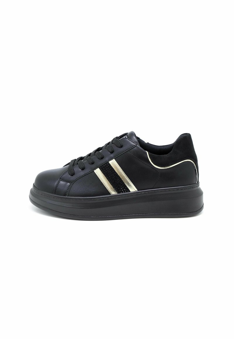 Black low-top sneaker with platform sole, black laces, and gold and black stripes on side, shown in profile on white background.