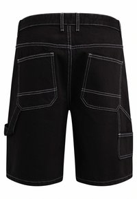 Black shorts made of durable fabric, featuring white stitching, multiple cargo pockets, and a relaxed fit design.