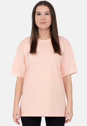 Hellrosa übergroßes Baumwoll-T-Shirt mit kurzen Ärmeln, Rundhalsausschnitt und lockerem Sitz, mit glatter Textur und ohne sichtbare Muster.