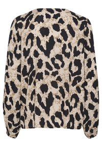Blouse à imprimé léopard avec un fond beige et des taches noires et brunes, manches longues et coupe décontractée.