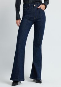 Flared jeans - navy blue