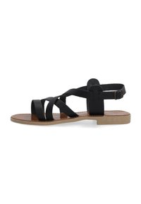 Schwarze Ledersandale mit überkreuzten Riemen, Knöchelriemen mit Schnalle, flacher Sohle und braunem Innenfutter. Einfaches Design, minimale Hardware und keine Verzierungen.