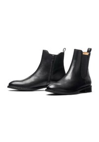 Stivali ankle neri in pelle con zip laterale, pannelli elastici, punta arrotondata, tacco basso a blocco e una texture liscia.