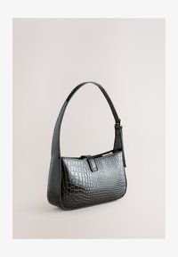 Sélectionné, black croc