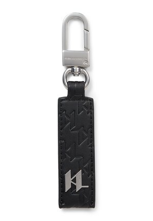 Black leather keychain with embossed geometric pattern and silver metal clasp engraved with brand name.