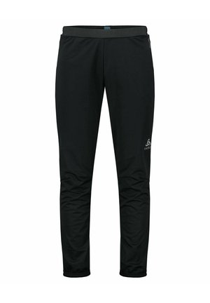 Pantalons de plein air noirs à coupe fuselée, avec une taille élastique et des poignets zippés. Fabriqués à partir d'un matériau léger et résistant à l'eau. Logo sur le côté.