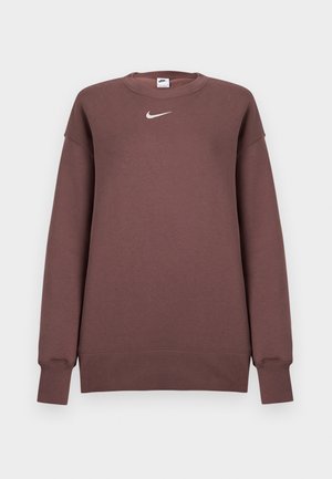 Brun Nike-tröja i mjukt tyg med rund halsringning och långa ärmar. Har en liten vit logotyp på bröstet.