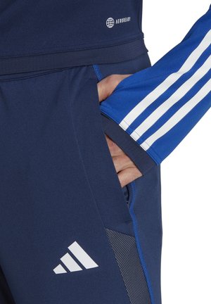 FUSSBALLTIRO  - Tracksuit bottoms - dunkelblauweiss