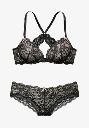 Black lace bra and matching panties featuring floral patterns, scalloped edges, adjustable straps, and pink ribbon accents.