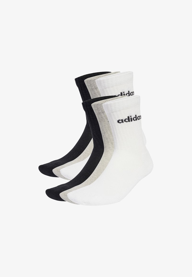Fünf Paar knielange Socken in Schwarz, Grau und Weiß mit "adidas" Logo an den Bündchen, nebeneinander auf weißem Hintergrund angeordnet.