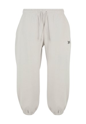 Light gray sweatpants made of soft fabric, featuring an elastic waistband with a drawstring, elastic cuffs, and a small black logo accent.