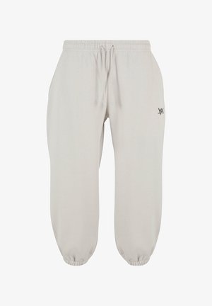 Pantaloni della tuta grigi chiari realizzati in un tessuto morbido, dotati di una vita elasticizzata con cordino, polsini elasticizzati e un piccolo accento del logo nero.