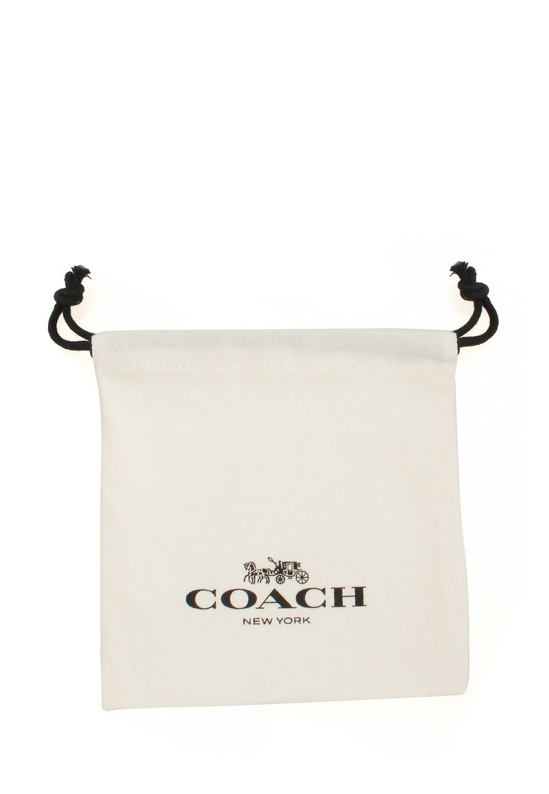 Weiße Canvas-Zugtasche mit schwarzem Coach New York-Logo. Das Design umfasst zwei schwarze Schnüre oben zur Verschlüsselung.