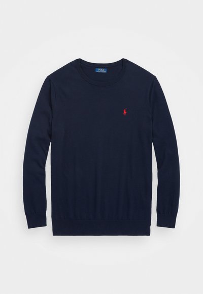 Navy crewneck sweater made of soft fabric, featuring long sleeves and a red embroidered logo on the chest. Ribbed neckline and cuffs.