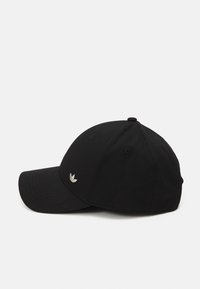 Black cotton baseball cap with a curved visor, adjustable strap, and a small silver logo on the front left panel.
