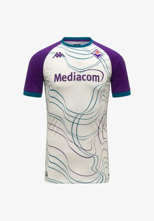 Maillot de football blanc avec manches violettes, bordure turquoise, lignes ondulées abstraites, sponsor "Mediacom", logo Kappa et écusson du club Fiorentina.