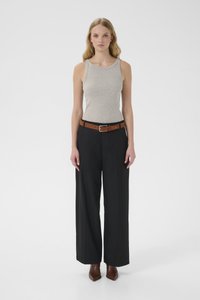 Gray tank top paired with black wide-leg trousers and a brown belt. Model wears brown heeled boots. Plain white background.