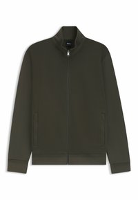 Donkergroene ritsjack met een opstaande kraag, voorzien van twee zijzakken en ribgebreide boorden en onderkant. Gladde stof met een subtiele textuur.