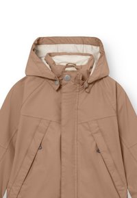 Light brown water-resistant jacket with a hood, front snap closure, side pockets, and a smooth inner lining. Features angled seams and gray accents.