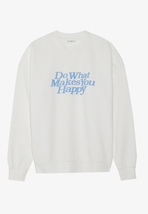 Hvit genser med rund hals som har en blå grafisk tekstdesign med teksten "Gjør det som gjør deg glad." Mykt stoff, ribbede ermer og nederkant.