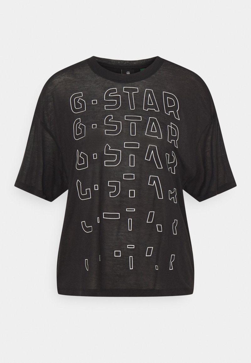 Černé oversized tričko s krátkým rukávem a kulatým výstřihem, na kterém jsou bíle konturované abstraktní písmena tvořící vzor "G-STAR" na přední straně.