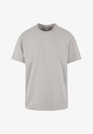 Vaaleanharmaa puuvillainen t-paita, lyhyet hihat, pyöreä kaula-aukko, rento istuvuus, sileä rakenne, ei kuvioita tai näkyviä graafisia elementtejä. Siisti muotoilu.