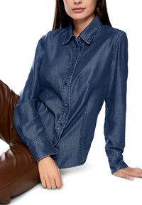Denim button-up shirt in dark blue with a classic collar, long sleeves, and subtle stitching details. Smooth texture with a fitted silhouette.