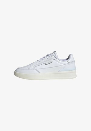 White leather sneakers with a smooth finish and subtle stitching details. Features a rubber sole and a minimalist design with gray accents.