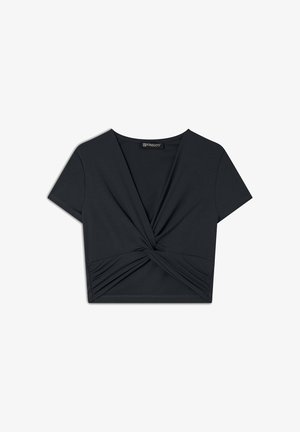 Maglietta nera cropped realizzata in tessuto morbido ed elasticizzato. Presenta un dettaglio a nodo attorcigliato sul davanti e maniche corte. Texture liscia.