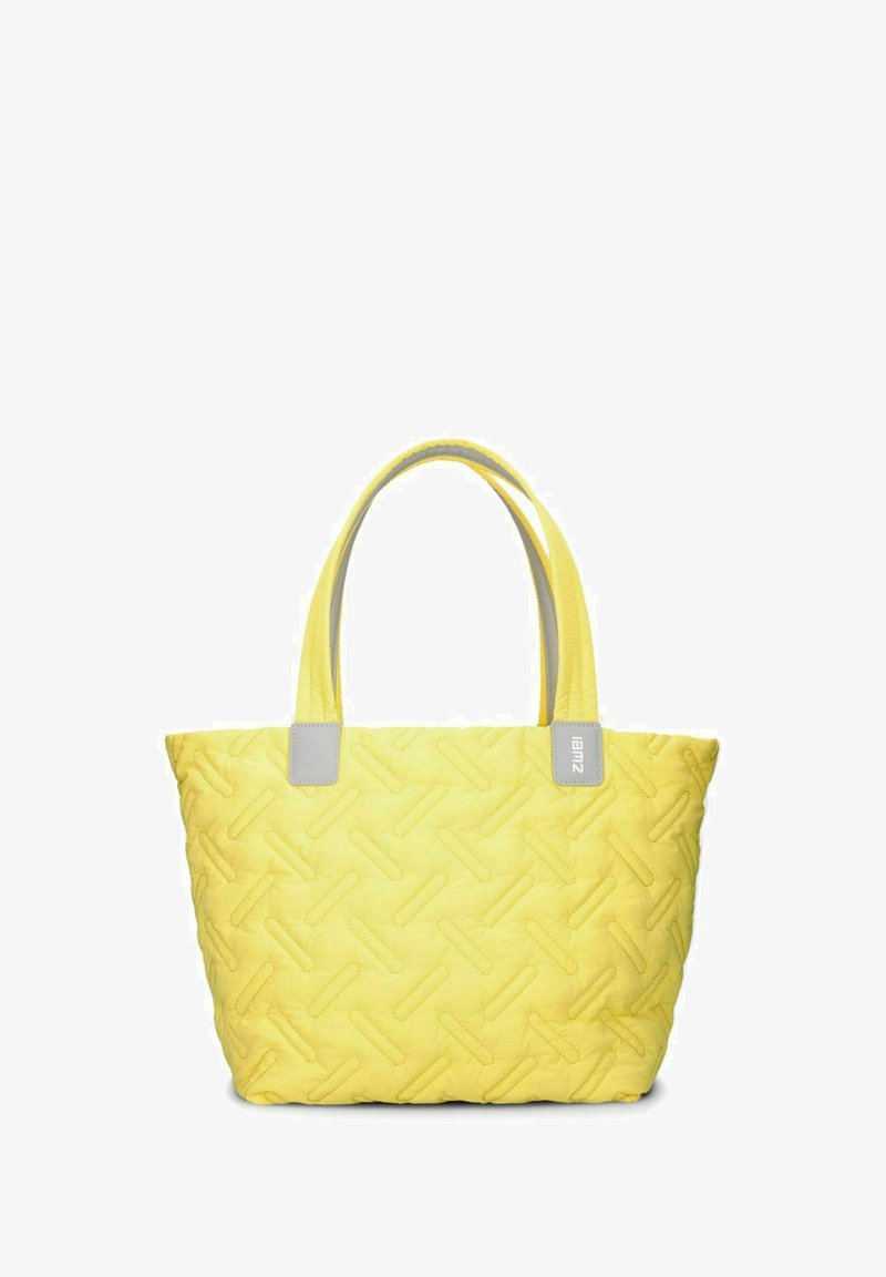 Bolso tote acolchado amarillo con correas gris claro, que presenta un patrón texturizado y forma rectangular. Ideal para uso casual o compras.