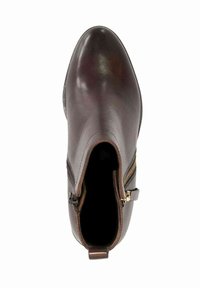 Bottine en cuir marron foncé avec un bout arrondi, une fermeture éclair sur le côté et une bride à l'arrière, vue de dessus.