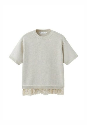 Pull beige à manches courtes en maille, col rond avec bordure en dentelle dépassant l'ourlet.