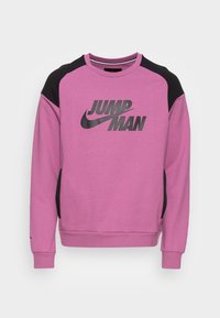 Maglione a maniche lunghe viola e nero con testo "Jumpman" e logo swoosh Nike neri sul petto, con polsini e orlo a costine.