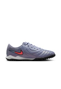 Nike soccer shoes in purple and white, featuring a textured synthetic upper, rubber sole, and a red and blue logo accent on the side.