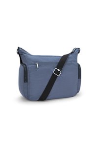 Borsa a tracolla in tessuto blu testurizzato, con tasca con zip, tracolla nera regolabile e forma arrotondata con accenti laterali.
