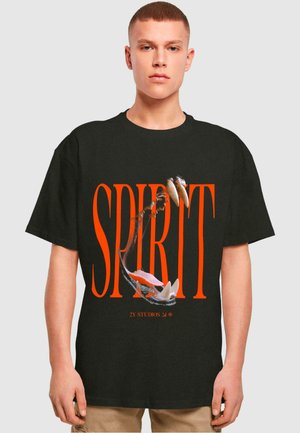Black cotton t-shirt featuring large orange text "SPIRIT" and graphic of a mouth with sharp teeth. Short sleeves, relaxed fit.