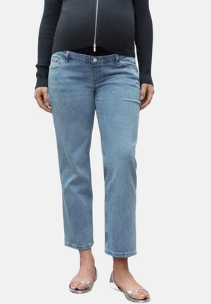 Light blue denim jeans featuring a straight cut, five-pocket design, and subtle fading. Paired with silver open-toed sandals.
