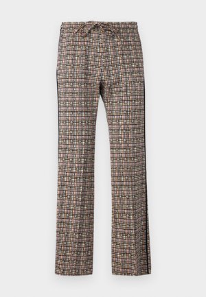 Ar pītām platām biksēm ar saites jostu. Iezīmēts ar režģa dizainu rozā, melnā, baltā un zaļā krāsā, ar ziedu akcentiem.