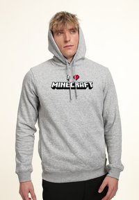 Gray cotton hoodie with a front pocket, featuring a large "I ♥ MINECRAFT" logo in pixelated style. Adjustable drawstring hood.