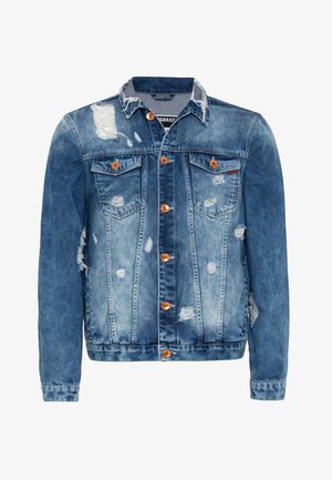Denimjacket in vervaagd blauw met versleten gebieden, twee borstzakken, oranje knopen en een rafelige kraag. Klassieke snit met een lichte tapering.