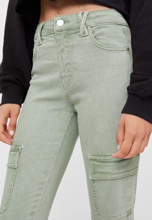 Reisitaskuhousut - green