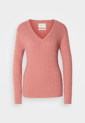 Sweater rosa em V, feito de um tecido de malha texturizada, apresentando um padrão de cordas e punhos e bainha canelados. Pequeno detalhe do logótipo no peito.