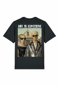Black cotton t-shirt featuring a graphic of two figures in sunglasses, one in a sequined suit, with the text "ART IS EXPENSIVE."