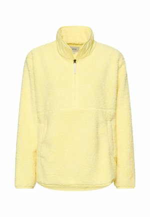 Żółty polarowy pulower z wysokim kołnierzem, zamkiem na pół długości i teksturowaną tkaniną. Posiada kieszeń kangurka i ściągacz na dole.