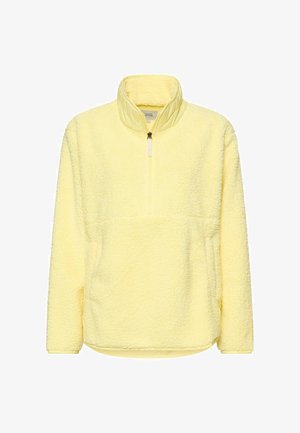 Geel fleece trui met een hoge kraag, halve rits en gestructureerde stof. Voorzien van een kangoeroezak en geribde zoom.