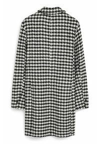 Manteau à manches longues avec un motif pied-de-poule en noir et blanc. Comprend un col et des boutons sur les manches. Tissu doux et texturé.